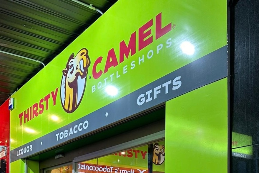 Shop signage with camel logo.