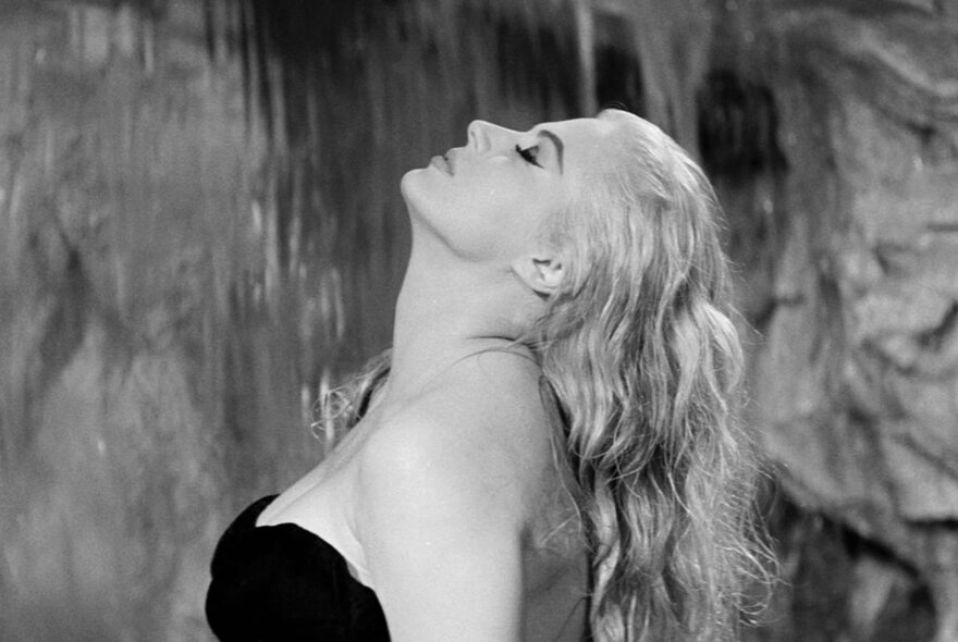 Actor Anita Ekberg in a Trevi Fountain still from Fellini's movie La Dolce Vita.