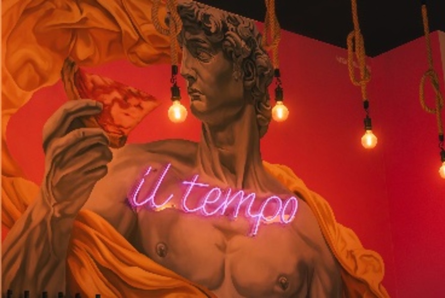 David's Michelangelo holding a slice of pizza, overlaid with neon il tempo sign.