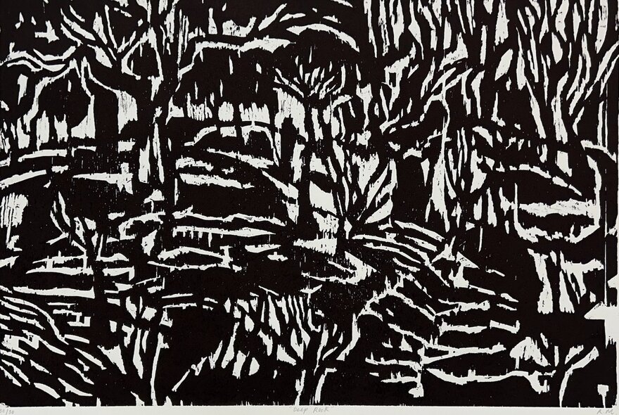 A black and white woodcut print of a forest.