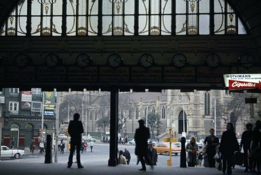 A colourised old photo of a train station 