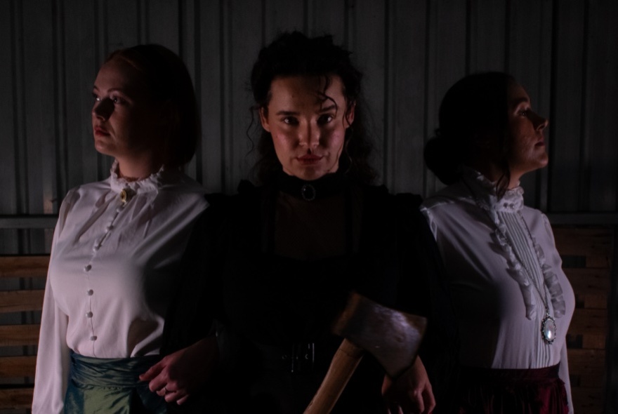 Actors dressed in 19th-century dresses.