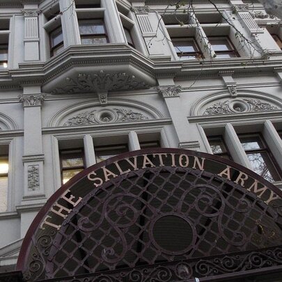 View from the street looking up at the historic Victorian-era Salvation Army building facade.
