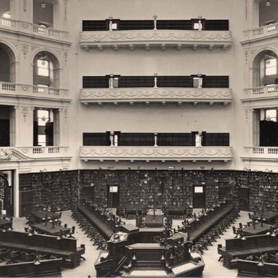 Black and white photograph showing a bird's-eye view of the Domed Reading Room at the State Library Victoria.
