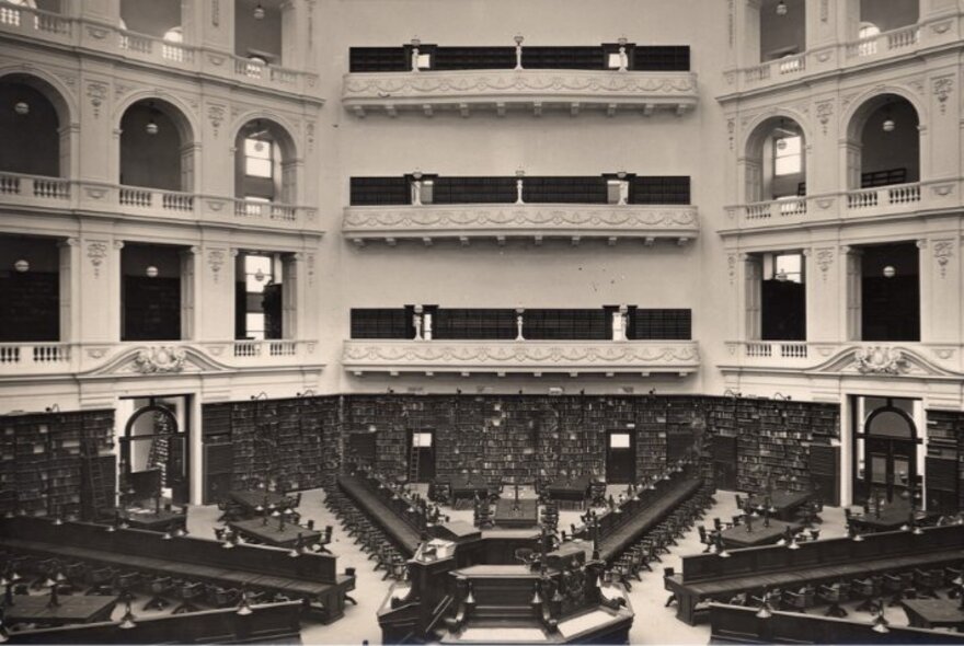 Black and white photograph showing a bird's-eye view of the Domed Reading Room at the State Library Victoria.