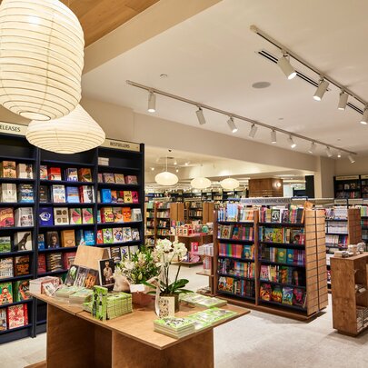 The inside of a carefully curated bookstore with shelves of books.