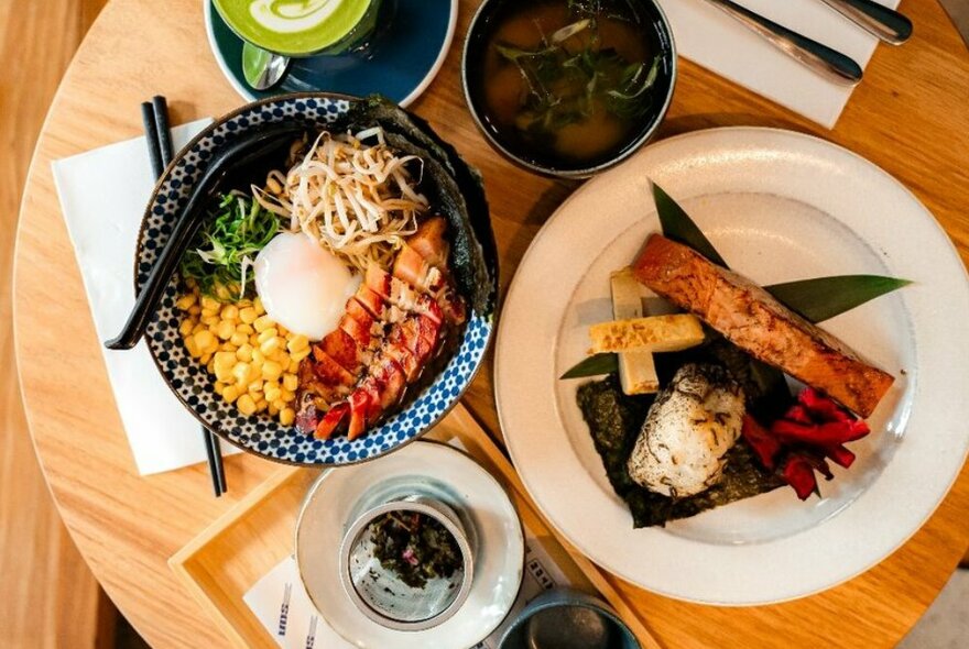 A selection of Japanese dishes including salmon and ramen.