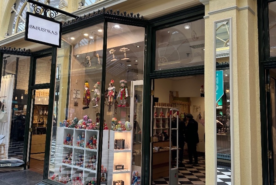 Shopfront in Royal Arcade with displays of Eastern European dolls.