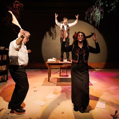 People performing a Greek dance in a stage production of Zorba's Last Dance.