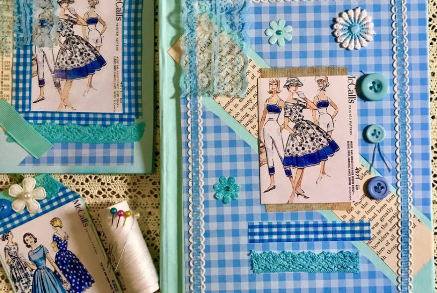 Journal bound in gingham fabric decorated with retro illustrations, buttons and lace.