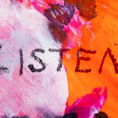 Artwork in pink and orange with the word LISTEN written in dark crayon.