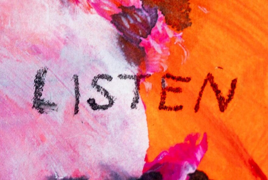 Artwork in pink and orange with the word LISTEN written in dark crayon.