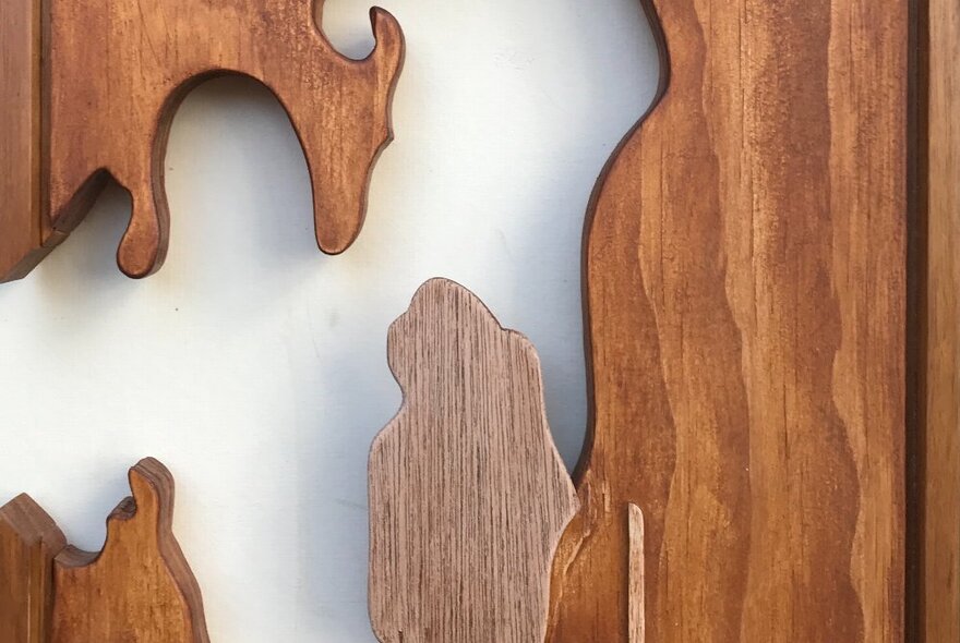 Abstract wood carving with curved shapes.