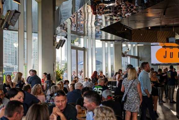 Groups of people sitting in a restaurant.