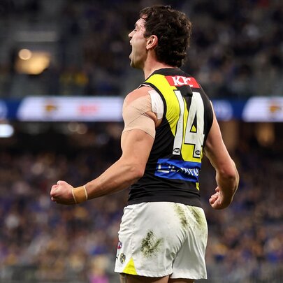 A Richmond football club player Tim Taranto celebrates on the field.