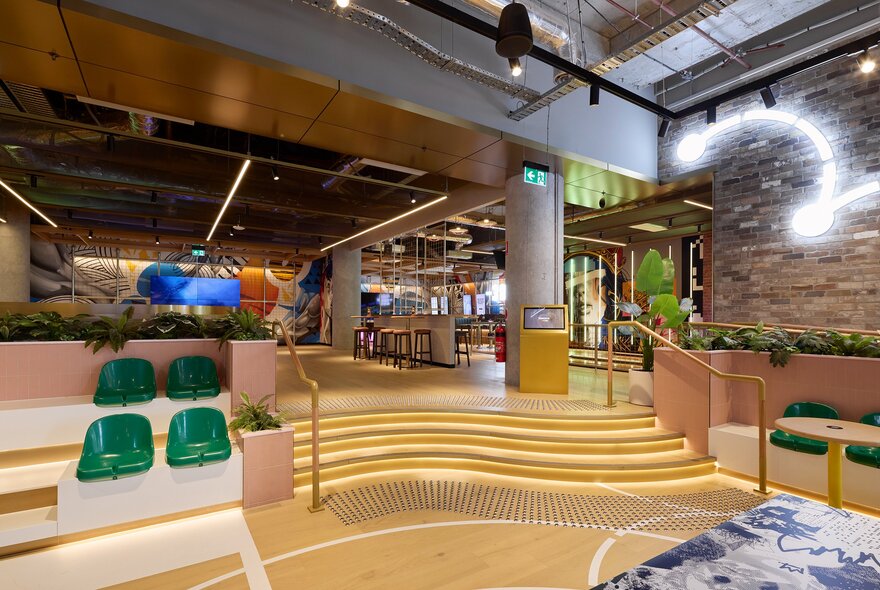 The interior of Kingpin Collins Street, a games and bowling venue, with a dining area in the background.