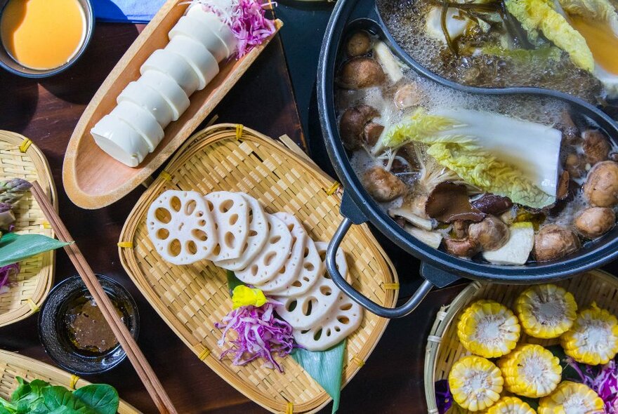 Slices of sweet corn, daikon radish and Japanese hot pot.