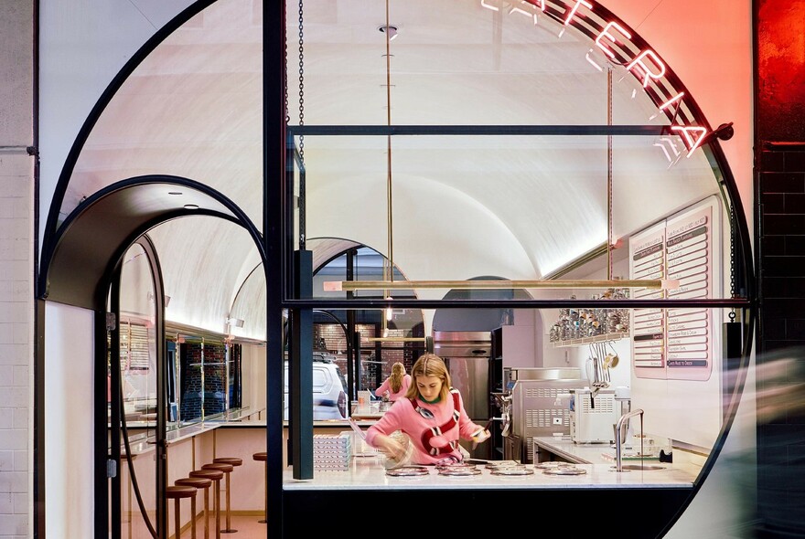 Person serving ice cream in Pidapipo Gelateria on Degraves Street.