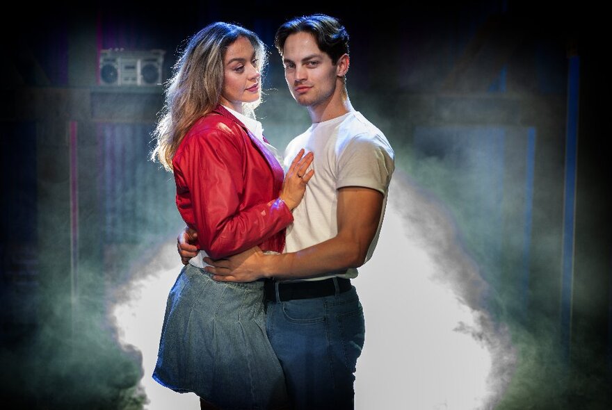 Man and woman standing together, dancing in a cloud of steam.