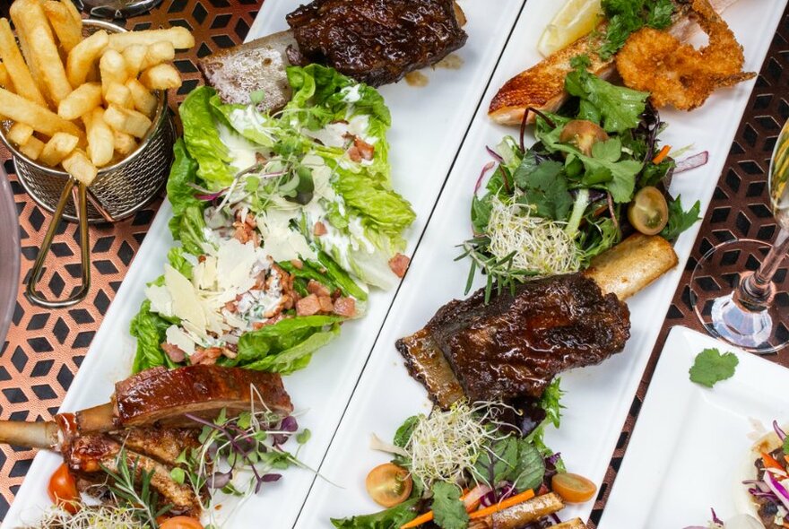 Platter of steak, chips and salad.