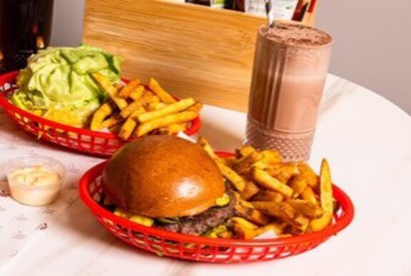 Red fast food baskets with burgers and fries