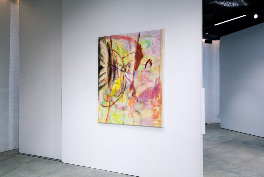 A large abstract artwork on a white gallery walll.