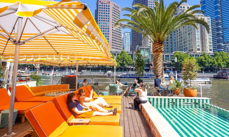 A riverside bar with a pool.