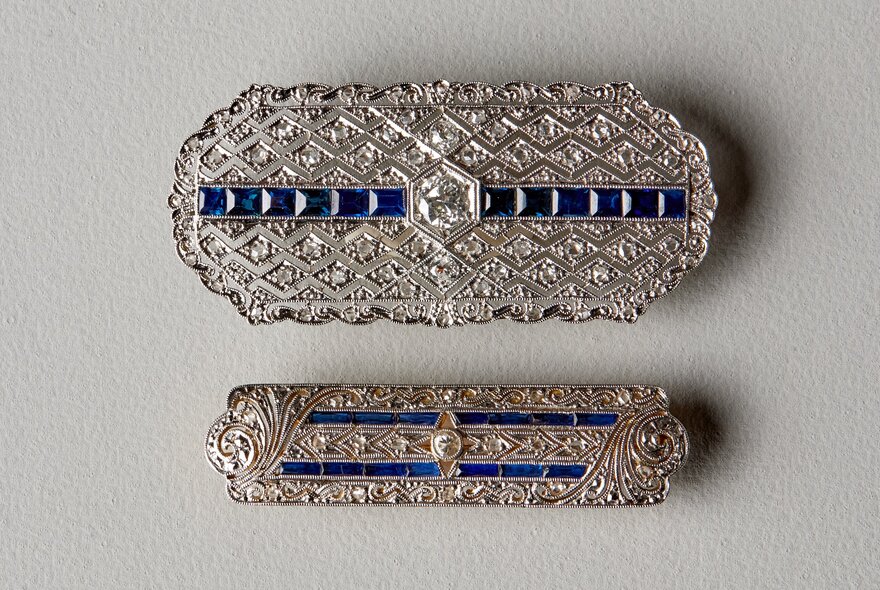 Diamond and sapphire Victorian brooches.