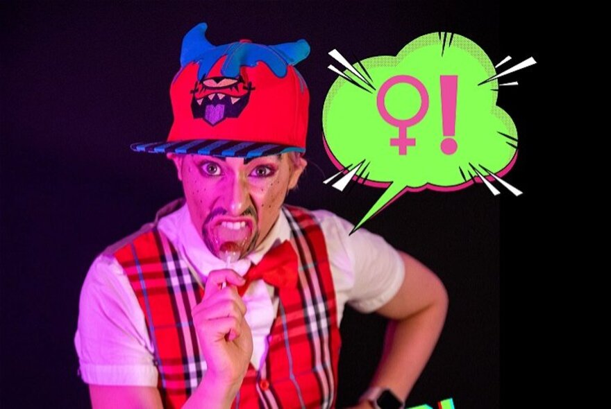 A woman dressed as a man wearing a red baseball cap, red tartan waistcoat and eating a lollipop; a speech bubble with the female sign and exclamation mark.