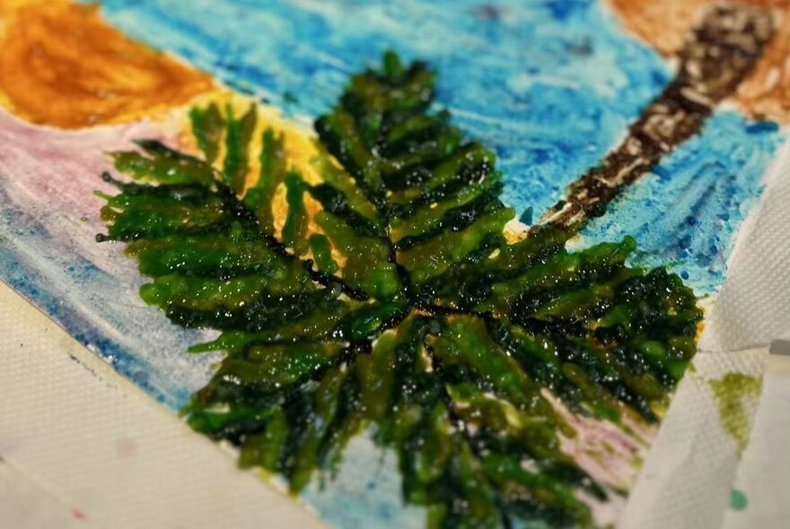 Painting of palm tree and sea.