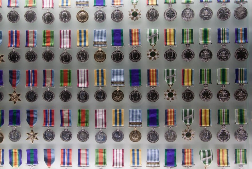 Rows of medals on display.
