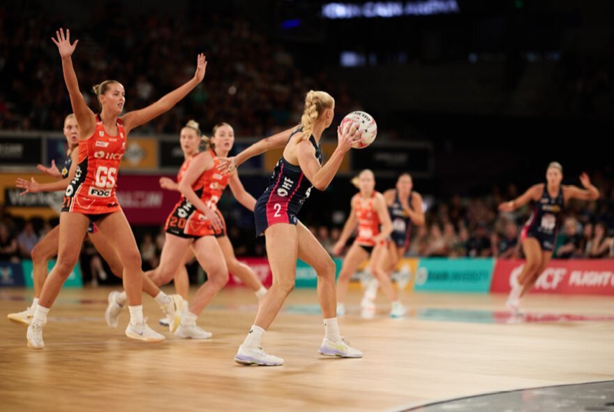 A netball match featuring the Melbourne Vixens and the Giants. 