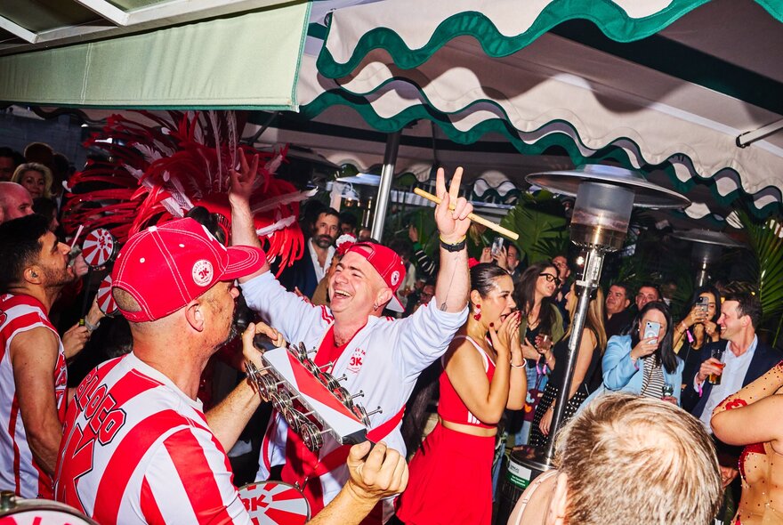 People enjoying themselves dancing and drinking on board Arbory Afloat bar.