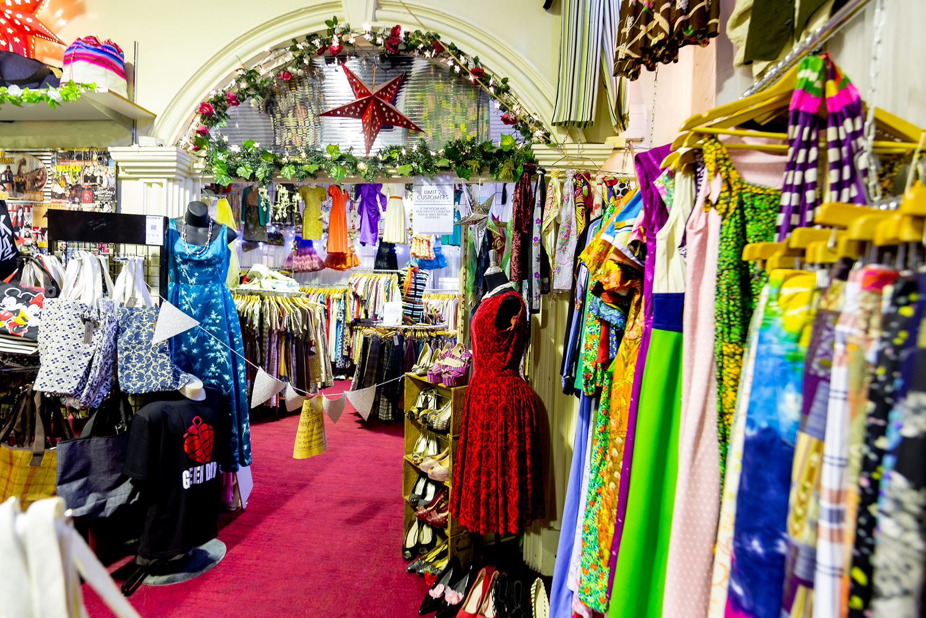A display of colourful vintage dresses.