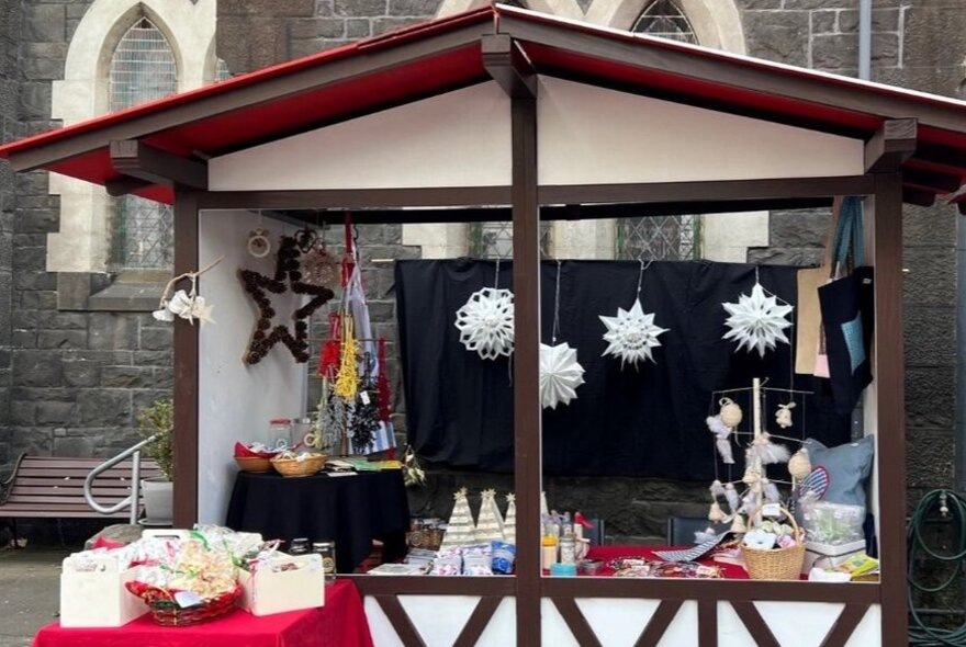 A German style market stall with paper decorations.
