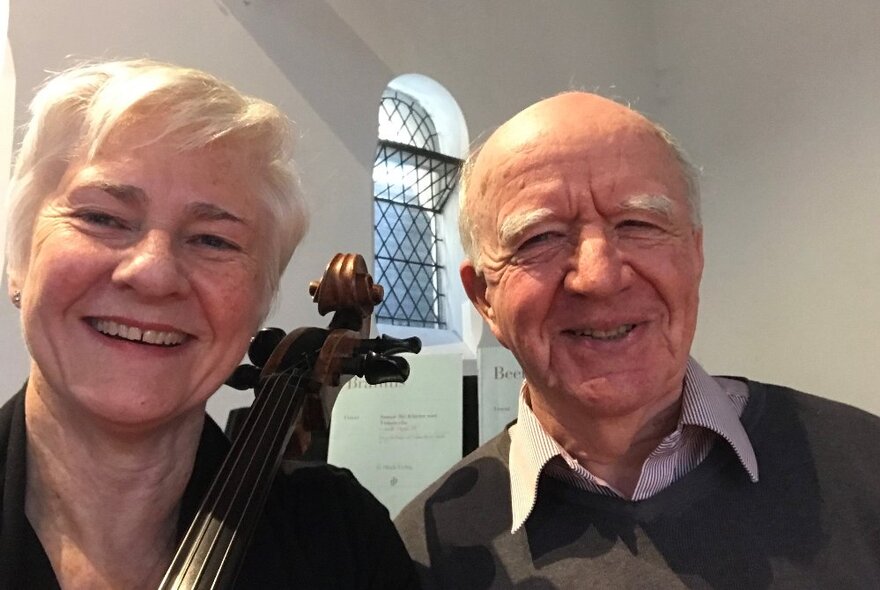 Cellist Sarah Cuming and organist Peter Adam smiling at the viewer.