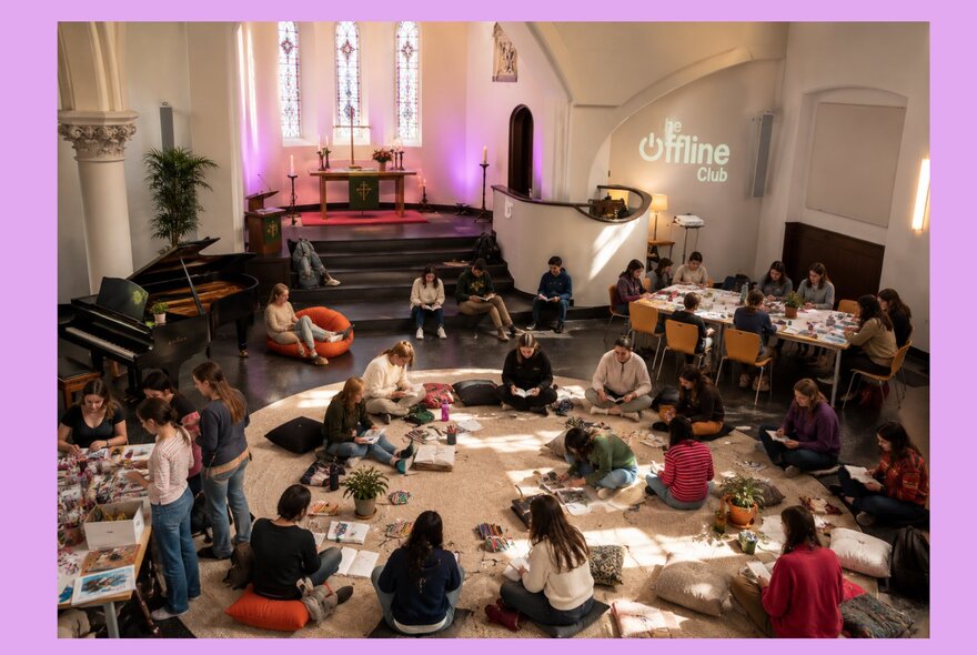 People enjoying a digital detox together inside a church space.