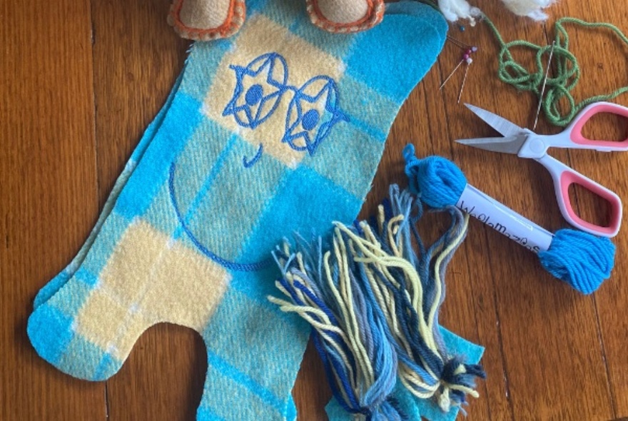 Wool scraps made into toys with faces and wool.