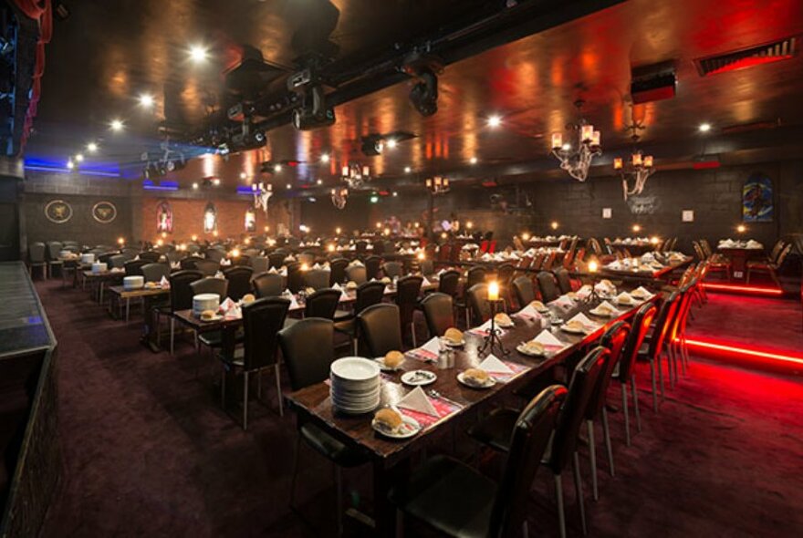 Long rows of tables set for dinner.