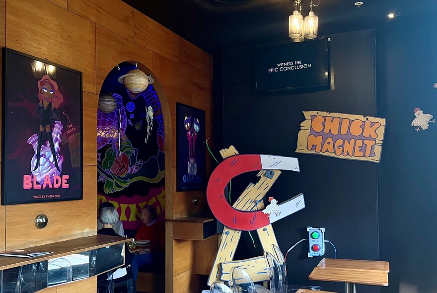 Magnet prop next to signage in a movie-themed bar.