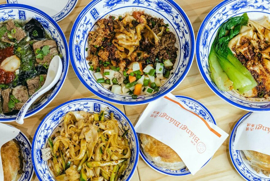 Bowls of Chinese food, viewed from above.