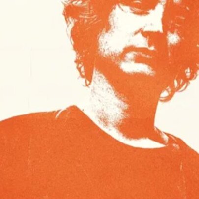Sampology DJ with cropped head and orange hue.