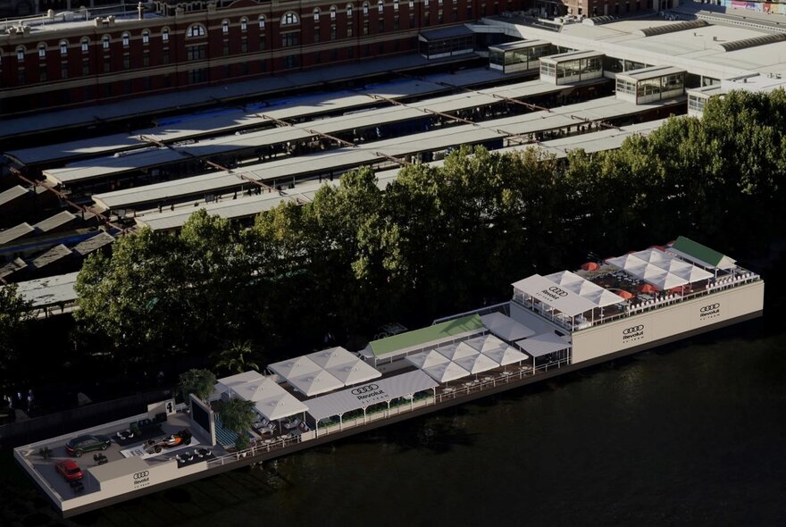 Aerial render of the pop-up exhibition and activation by the Audi Revolut F1 Team at Afloat on the Yarra River, with Flinders Street Railway station platform in the background.