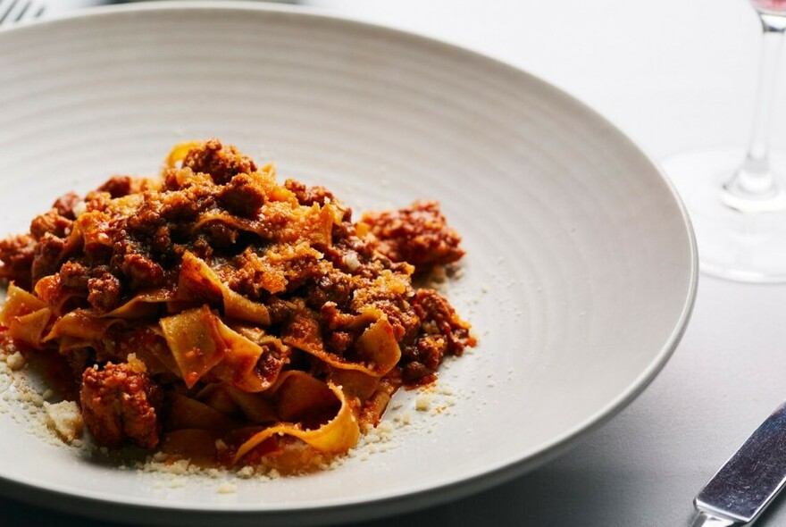 A plate of meat ragu pasta.