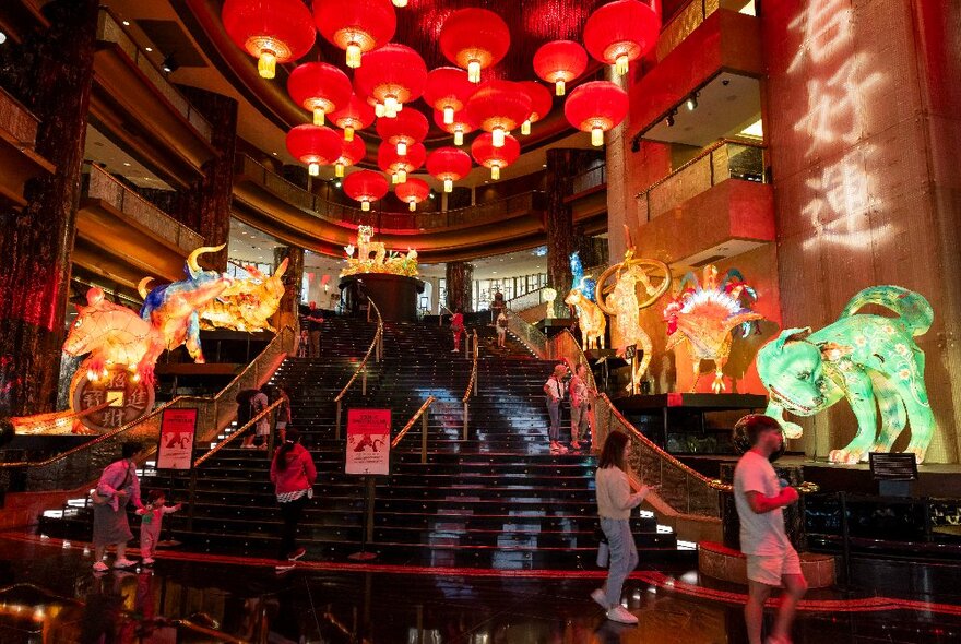 An illuminated Zodiac lantern installation displayed along the two sides of the large central staircase at Crown Melbourne's Atrium. 