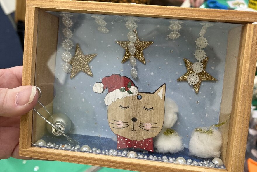 Hand crafted diorama with a festive cat. 