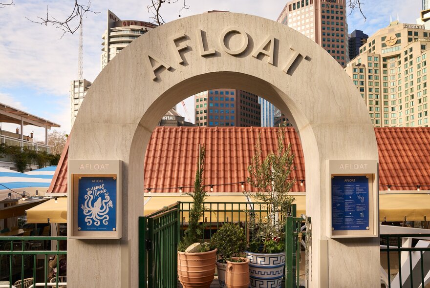 The arched entrance to Afloat on the Yarra, decorated in Mediterranean themed decor and terracotta pots.