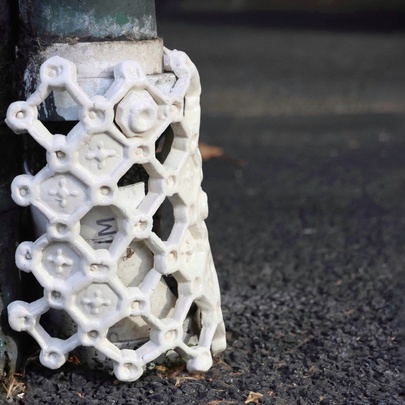 Sculptural detail on a street pole.