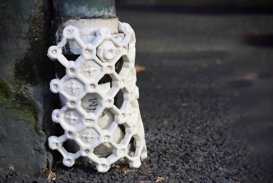 Sculptural detail on a street pole.