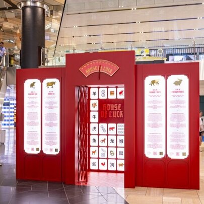 Shoppers standing around the House of Luck interactive installation at Emporium Melbourne, created for the Lunar New Year celebrations. 